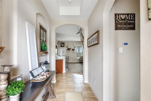 hallway featuring a skylight