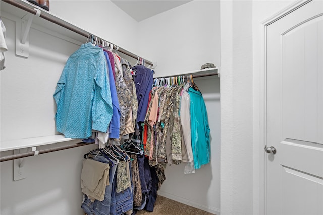 walk in closet featuring carpet