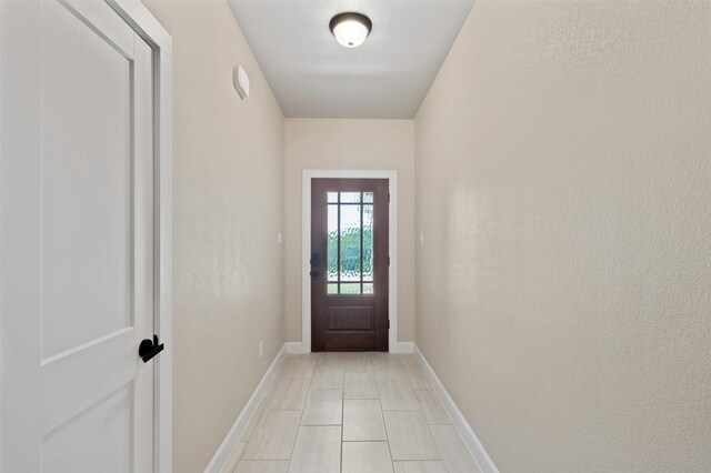 entryway featuring light tile patterned flooring