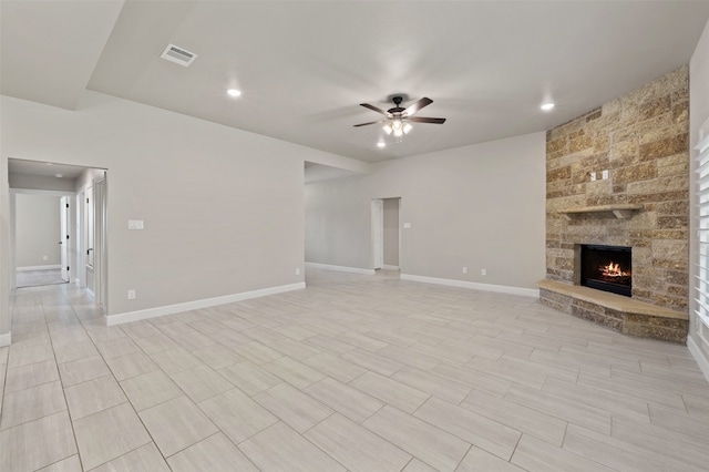 unfurnished living room featuring a fireplace and ceiling fan