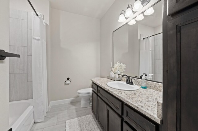 full bathroom featuring shower / bath combination with curtain, toilet, and vanity