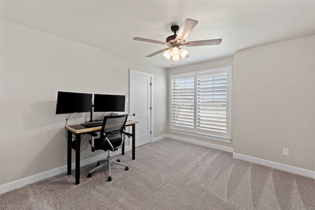 office space featuring light colored carpet and ceiling fan