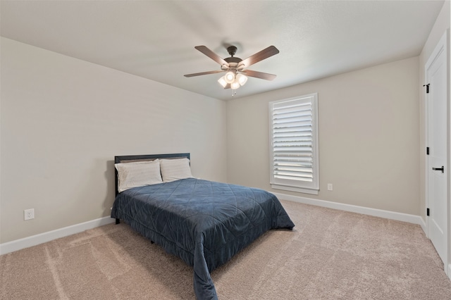 bedroom featuring ceiling fan and light carpet