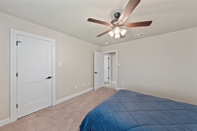 carpeted bedroom with ceiling fan