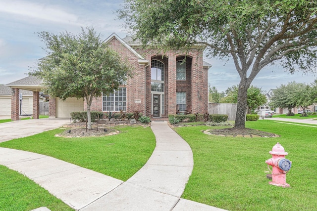 view of front of house featuring a front yard and a garage