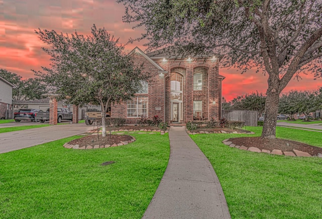 view of front of house with a yard