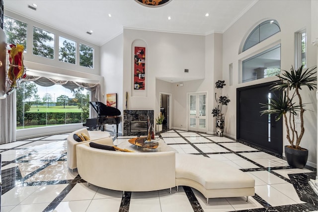 living room with recessed lighting, a premium fireplace, baseboards, and ornamental molding