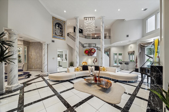 living room with recessed lighting, plenty of natural light, decorative columns, and baseboards