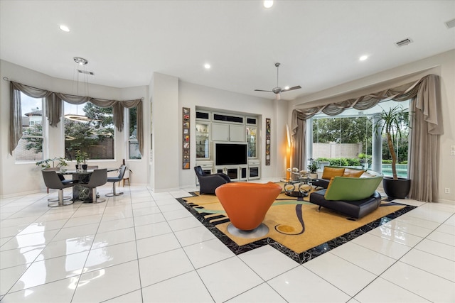 tiled living room with a ceiling fan, visible vents, and recessed lighting