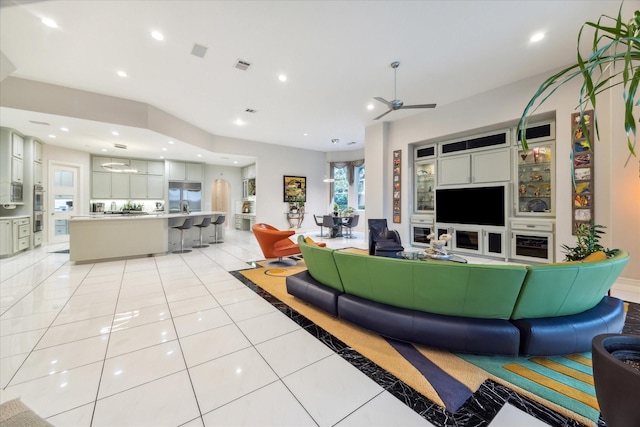 living room featuring recessed lighting, visible vents, ceiling fan, and light tile patterned floors