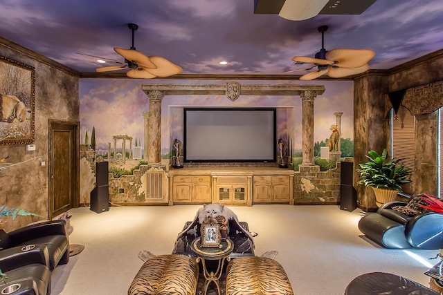 carpeted home theater room featuring a ceiling fan and crown molding