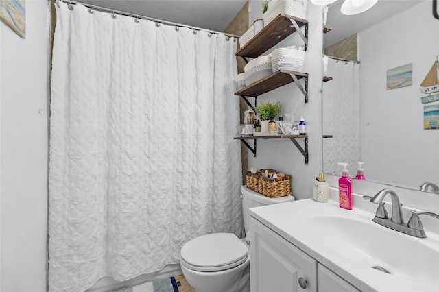 bathroom featuring vanity, toilet, and a shower with curtain