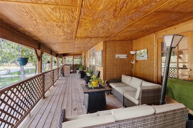 wooden deck featuring outdoor lounge area