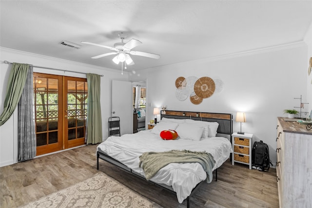 bedroom with ceiling fan, light wood-type flooring, multiple windows, and french doors