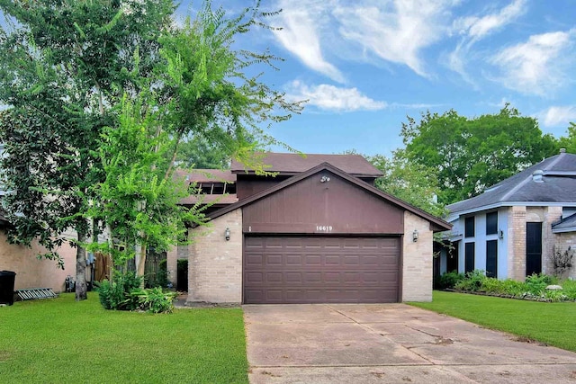 view of front of house with a garage and a front lawn