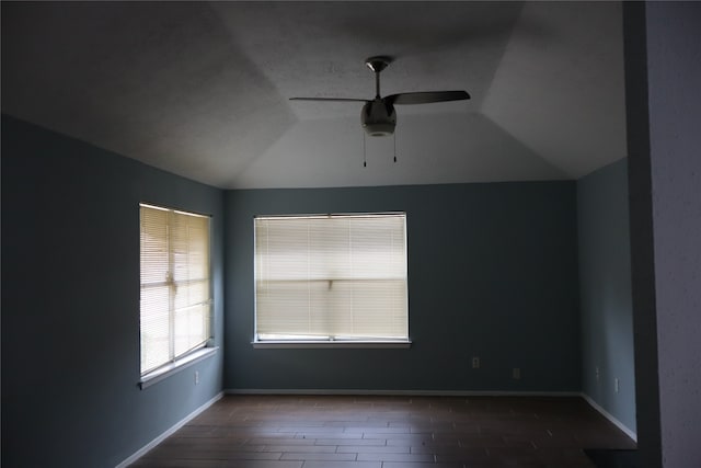 unfurnished room featuring lofted ceiling, ceiling fan, and wood-type flooring