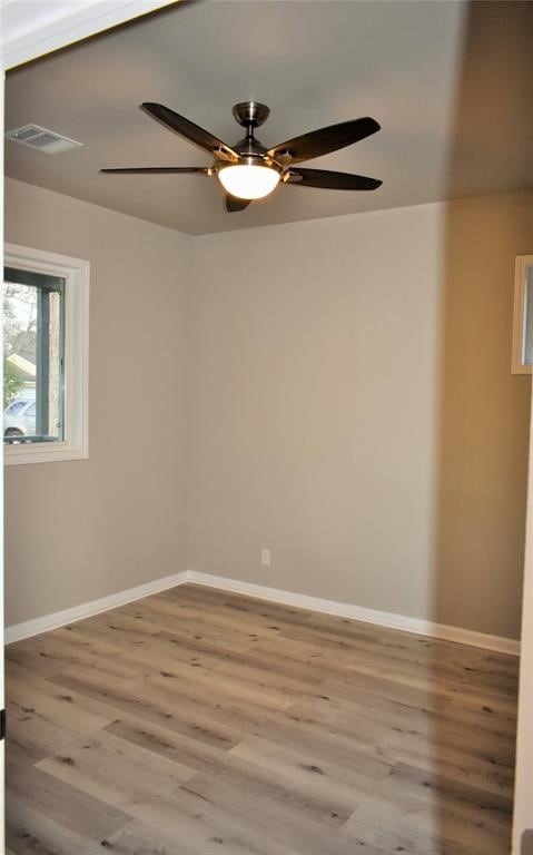 unfurnished room featuring ceiling fan and light hardwood / wood-style floors