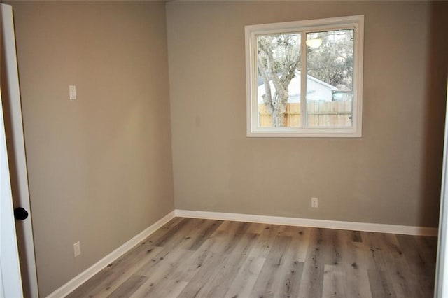 spare room with light hardwood / wood-style floors