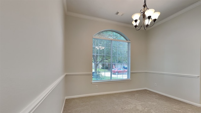 carpeted spare room featuring a notable chandelier and ornamental molding