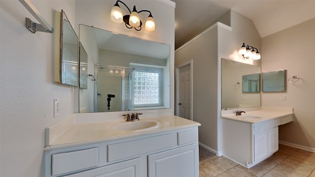 bathroom featuring lofted ceiling, vanity, tile patterned floors, and an enclosed shower