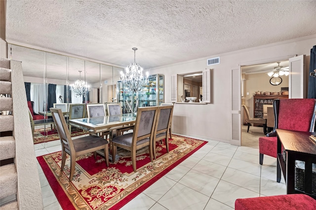 dining area featuring ceiling fan with notable chandelier, ornamental molding, light tile patterned flooring, and a textured ceiling