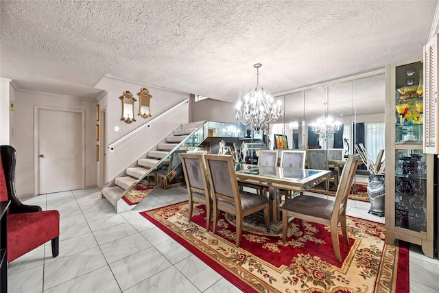 dining room with a textured ceiling and a chandelier