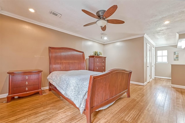 bedroom with crown molding, light hardwood / wood-style flooring, and ceiling fan