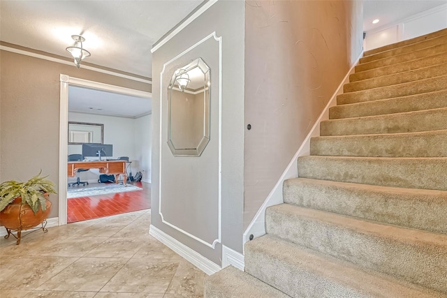 staircase with ornamental molding and wood-type flooring