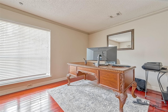 home office featuring crown molding, a textured ceiling, and hardwood / wood-style floors