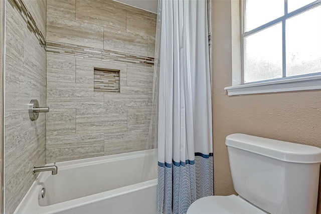 bathroom with toilet and shower / bathtub combination with curtain