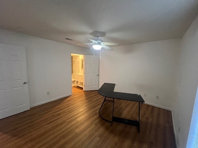 miscellaneous room featuring a textured ceiling, ceiling fan, and dark hardwood / wood-style flooring