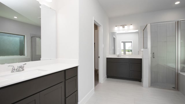 bathroom with vanity and walk in shower