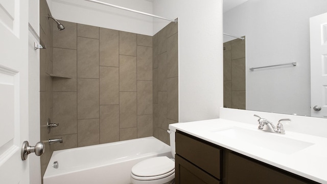 full bathroom with vanity, toilet, and tiled shower / bath