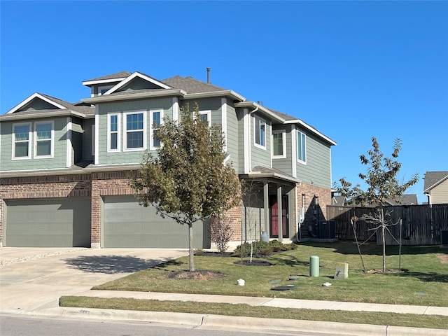 view of front facade with driveway, an attached garage, fence, a front lawn, and brick siding