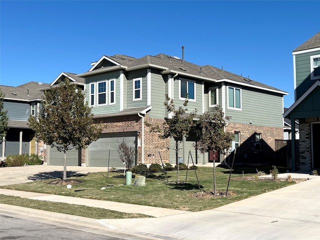 view of front of house with a garage, concrete driveway, brick siding, and a front yard