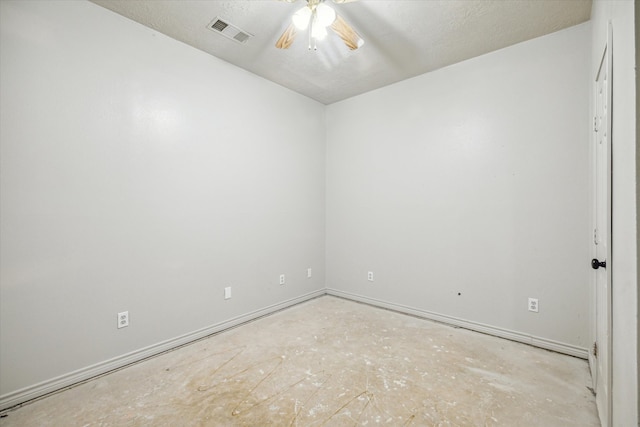 unfurnished room featuring ceiling fan and a textured ceiling