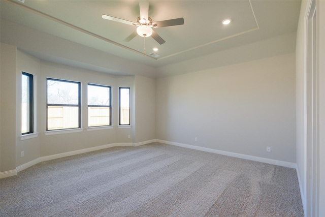 9715 Hunters Run Dr, Missouri City, TX 77459 - unfurnished room featuring a ceiling fan, baseboards, a tray ceiling, recessed lighting, and light colored carpet