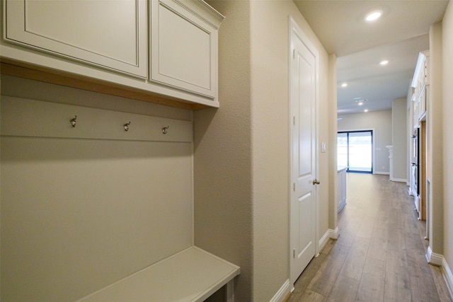 9715 Hunters Run Dr, Missouri City, TX 77459 - mudroom with recessed lighting, light wood-style flooring, and baseboards