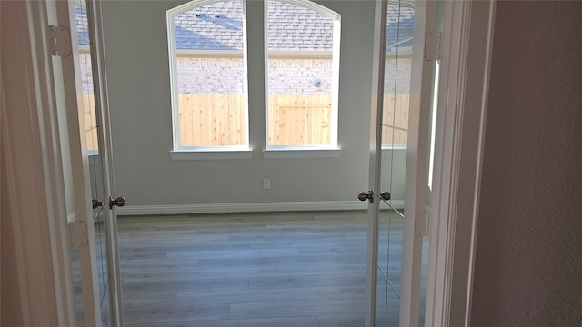 unfurnished room with plenty of natural light and light wood-type flooring