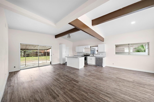 unfurnished living room featuring beamed ceiling and dark hardwood / wood-style flooring