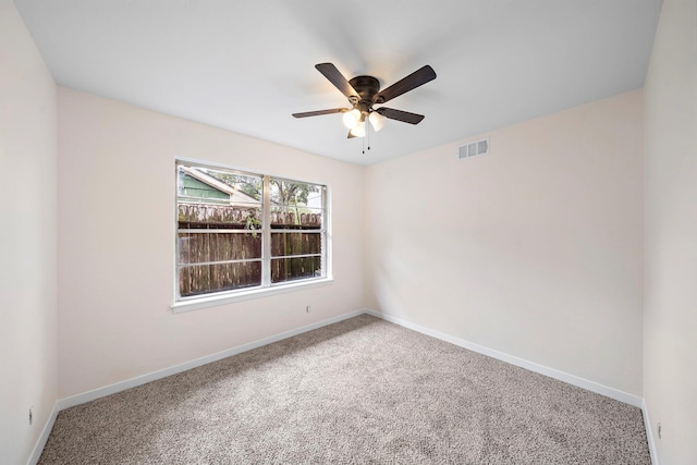 empty room with carpet flooring and ceiling fan