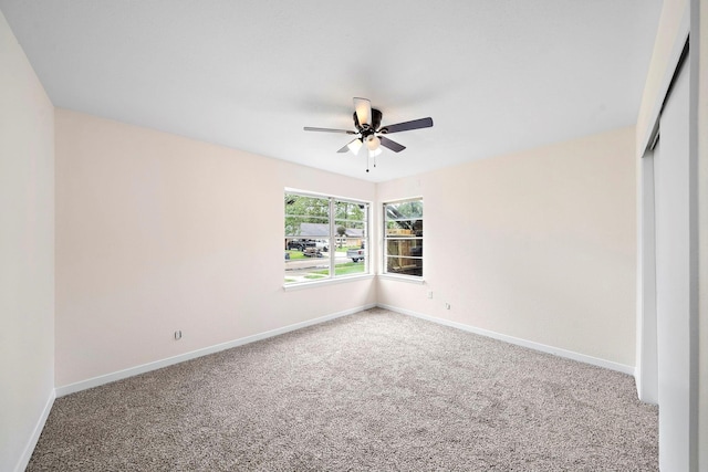 unfurnished bedroom featuring carpet, a closet, and ceiling fan