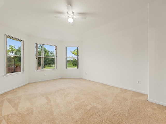 empty room with light carpet and ceiling fan