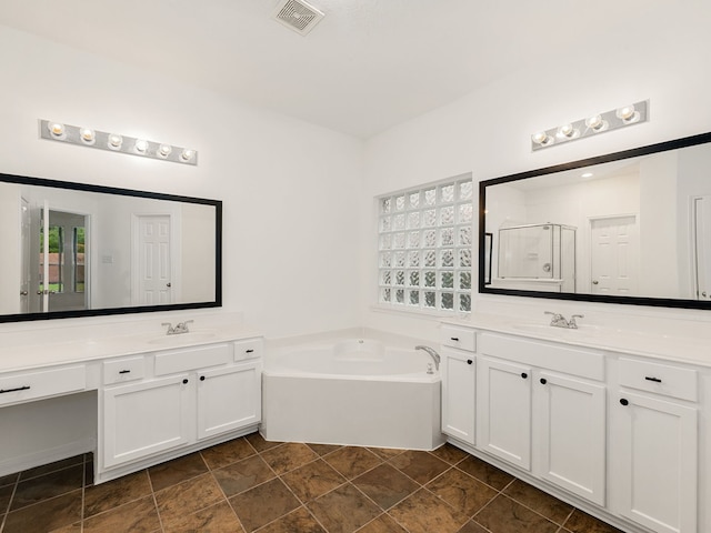 bathroom featuring vanity and plus walk in shower