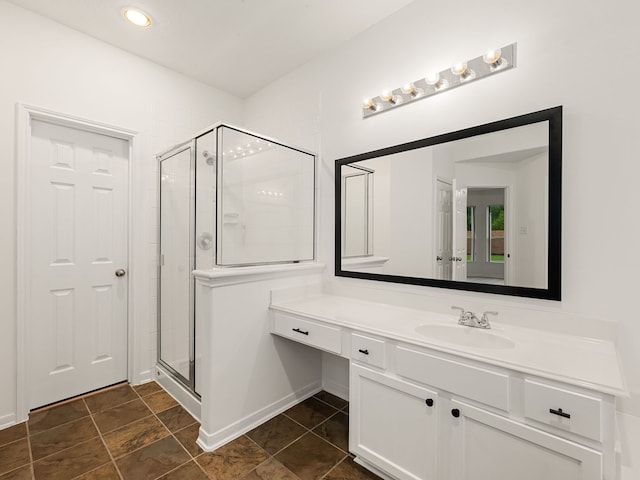 bathroom with vanity and an enclosed shower