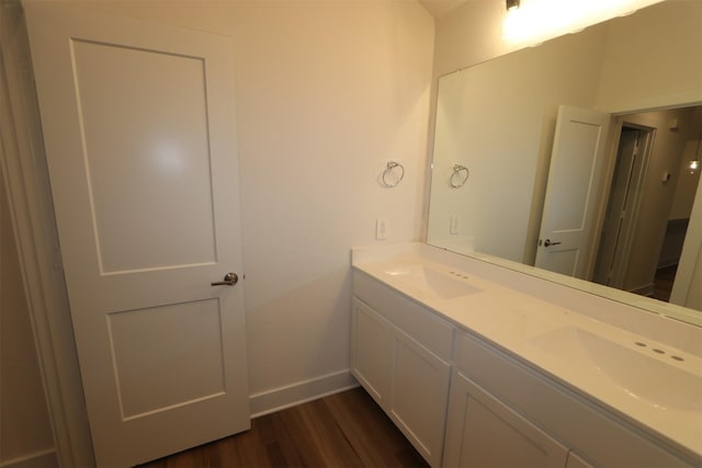 bathroom with vanity and hardwood / wood-style flooring