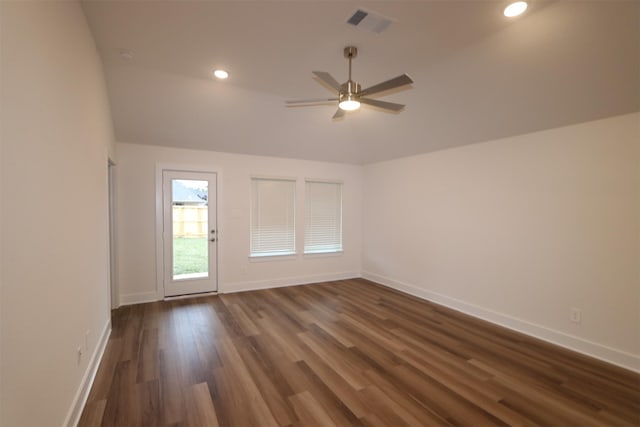 spare room with ceiling fan and dark hardwood / wood-style flooring