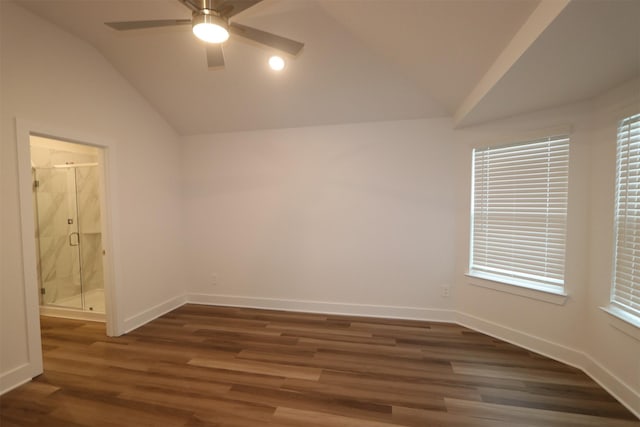 empty room featuring ceiling fan, dark hardwood / wood-style flooring, and lofted ceiling