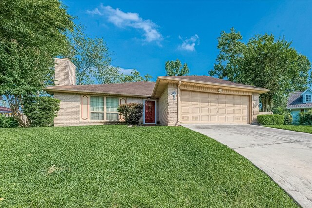 ranch-style home with a front lawn and a garage