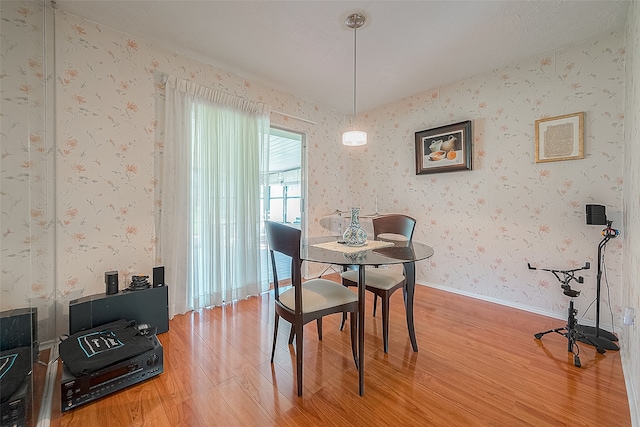 dining area with hardwood / wood-style flooring